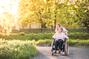 Life Assure Elderly Grandmother In Wheelchair With Grandaughter In Spring Nature Blog